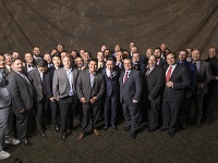 A large group of global men in gaming working side-by-side